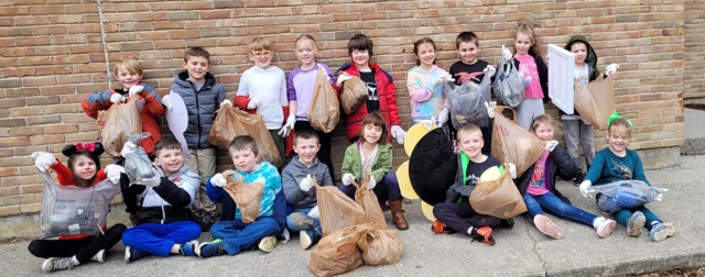 Memorial first-graders clean up