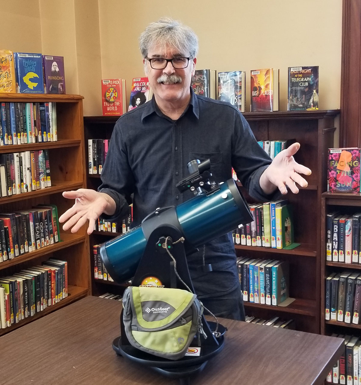 Manuel King with Library of Things